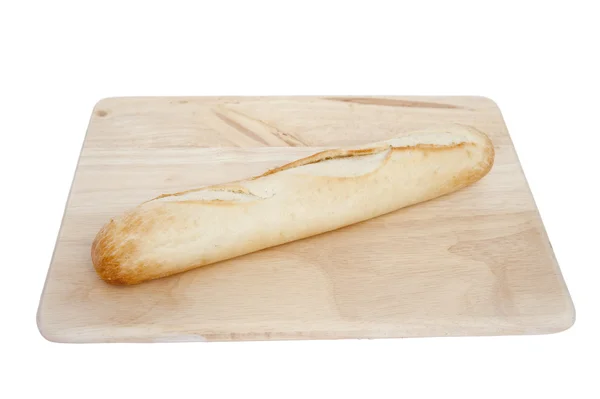 Fresh baguette on chopping board isolated on white — Stock Photo, Image