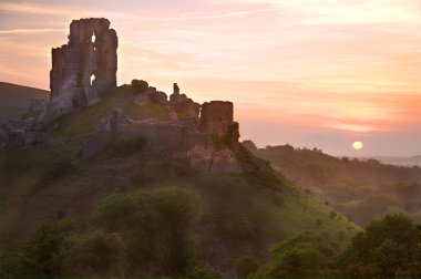 Romantic fantasy magical castle ruins against stunning sky clipart