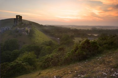 Romantic fantasy magical castle ruins against at sunrise clipart