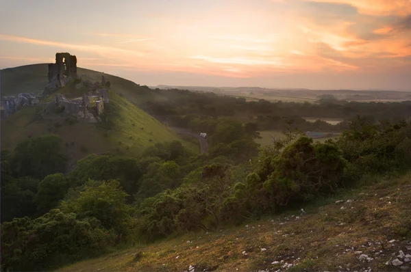 Romantic fantasy magical castle ruins against at sunrise — Stock Photo, Image