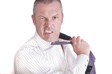 Angry frustrated stressed businessman pulls his tie off whilst m clipart