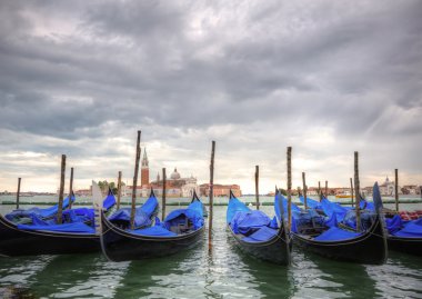 Gondolas bobbing in lagoon outside San Marco Piazza Venice Italy clipart