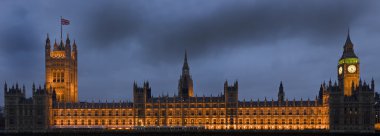 Full view of Houses of Parliament in Westminster London at twilight viewed clipart