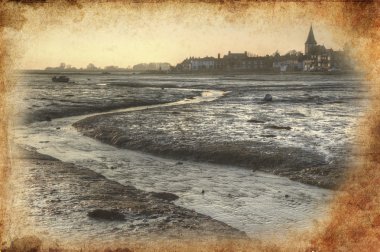 Low tide harbour at sunset with nearby town in distance retro gr clipart