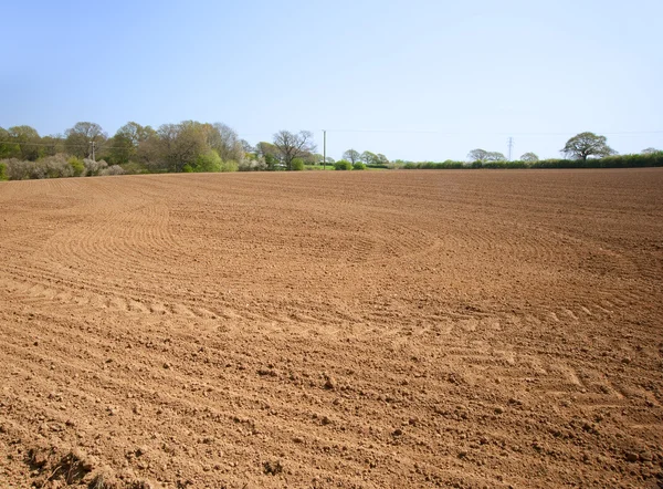 stock image Ploughed cultivated farmland waiting for sowing of crop