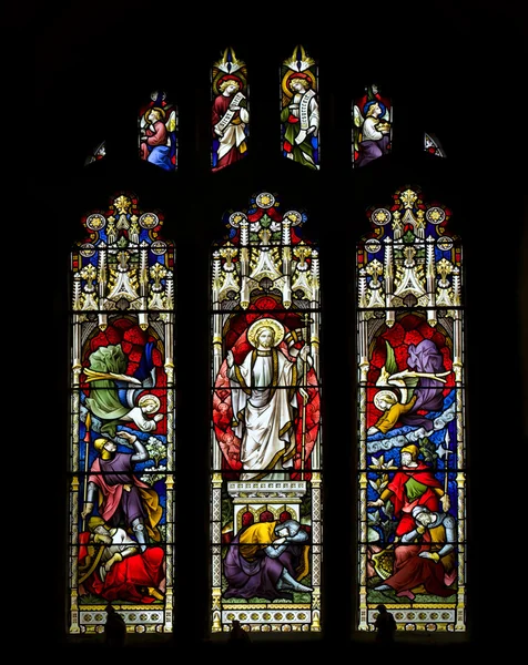 Beautiful stained glass window in 15th Century Saxon church depi — Stock Photo, Image