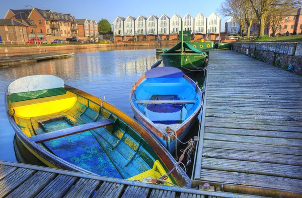 stock image Bright colorful rowing boats in urban canal landscape