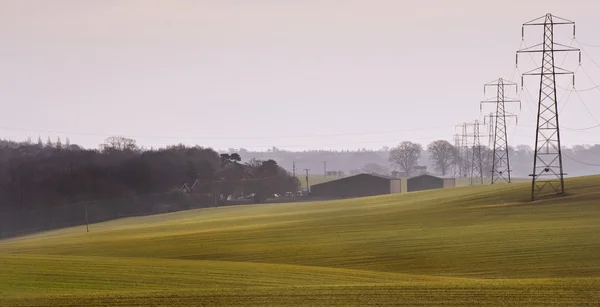 stock image Electricity cable communication towers on sunrise landscape