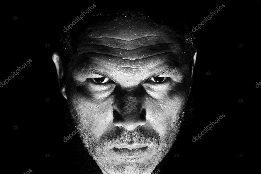 Low key portrait of menacing looking caucasian man — Stock Photo ...