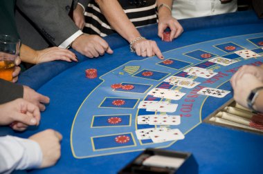 Image of men and women gambling playing blackjack cards clipart