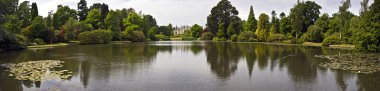 Large Lake Panorama surrounded by trees clipart