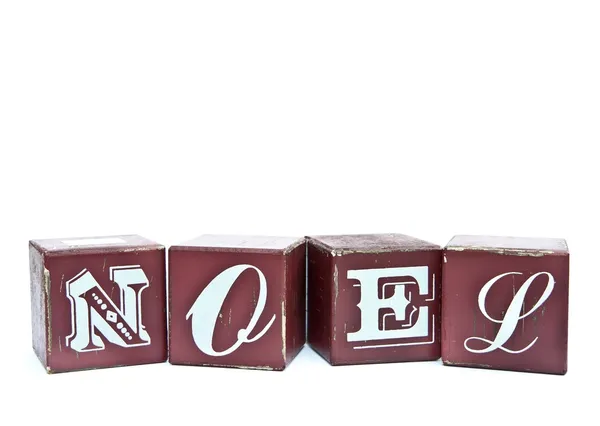 Christmas word Noel on wooden blocks isolated on white — Stock Photo, Image