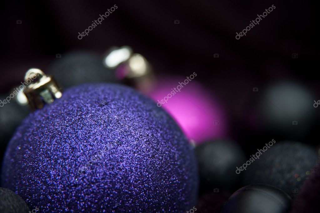 Unusual purple Christmas decorations against black background wi Stock  Photo by ©Veneratio 7149492