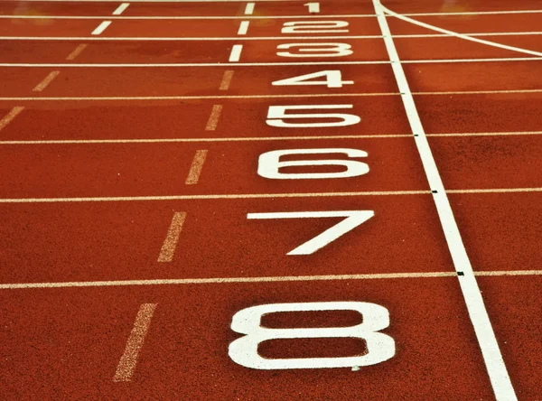 Atletismo pista de corrida linha de chegada início — Fotografia de Stock