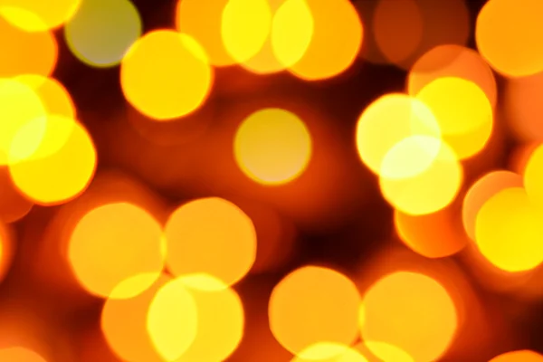 Holiday defocused guld och orange lampor — Stockfoto