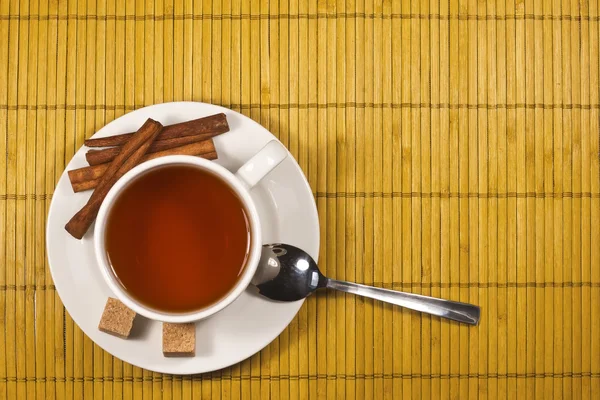 Tea with sugar and cinnamon — Stock Photo, Image