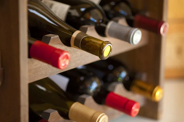 Wine bottles in rack — Stock Photo, Image