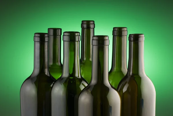 Wine bottles on green — Stock Photo, Image