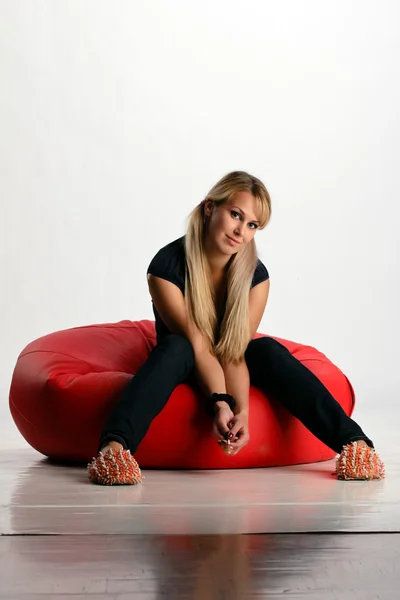 stock image Pretty girl on pouf