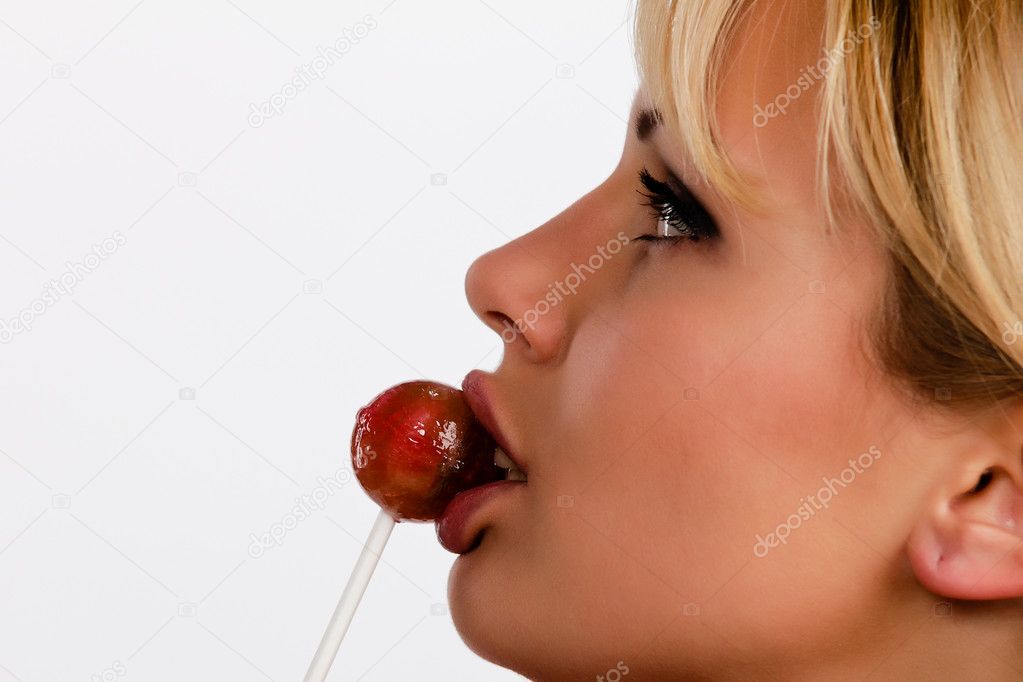 Licking a lollipop