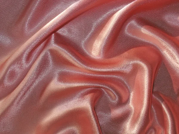 Draped pink (peachy) satin background — Stock Photo, Image