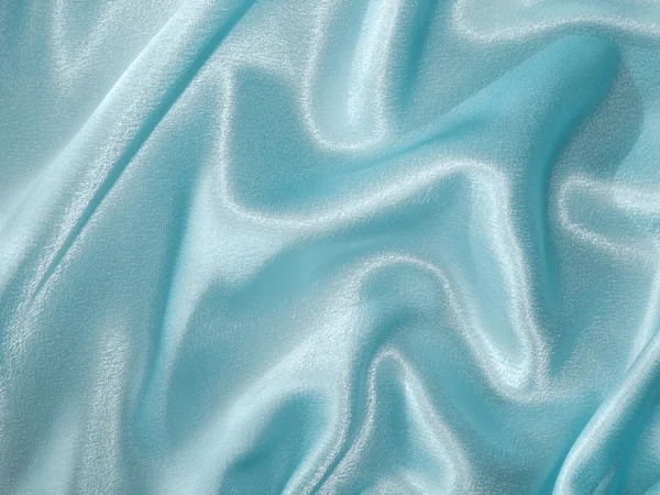 Jasnoniebieskie satynowe - tkanina tło — Zdjęcie stockowe