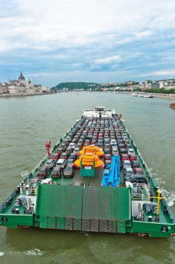 Tanker with a lot of cars carried to the market clipart