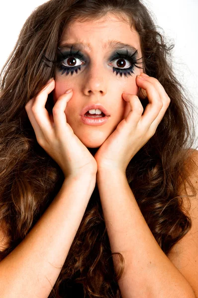 Terrified young girl with extreme makeup — Stock Photo, Image