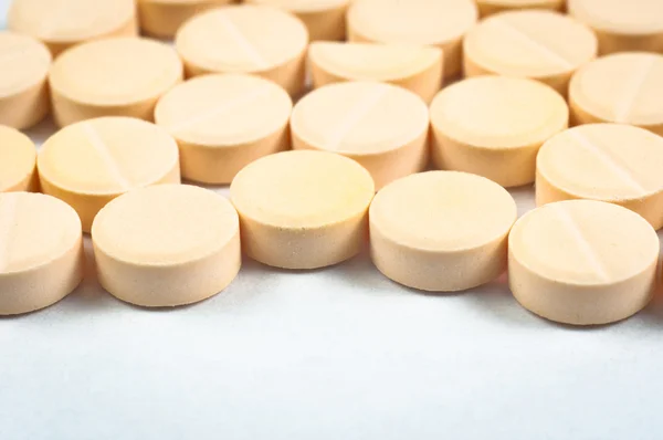Textura de píldoras médicas sobre fondo blanco — Foto de Stock