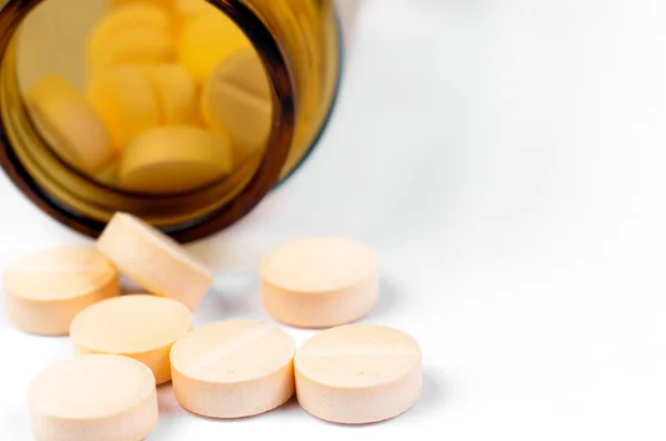 Pills and bottle on white isolated background — Stock Photo, Image
