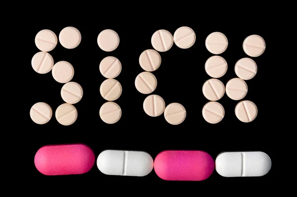 Sick Word made out of pills — Stock Photo, Image