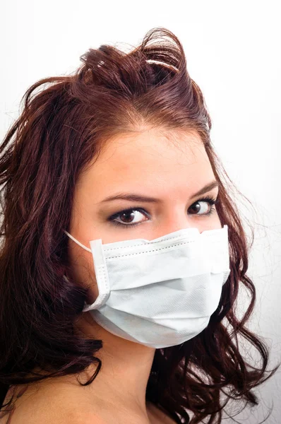 Close-up van een meisje in medische masker — Stockfoto