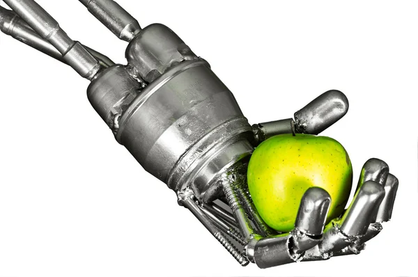 Рука робота с зеленым яблоком на изолированном белом фоне — стоковое фото