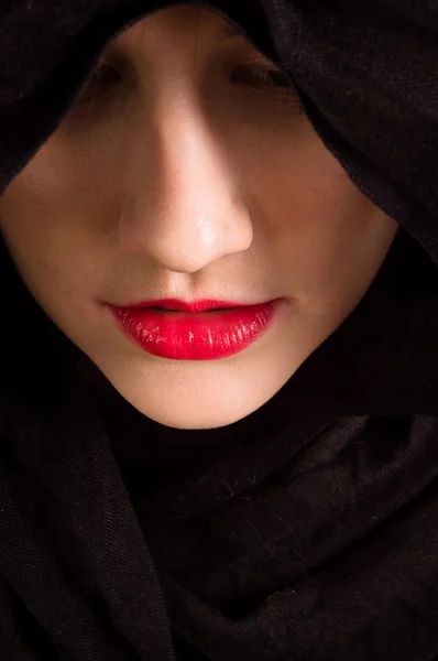 Girl looking down with black hood — Stock Photo, Image