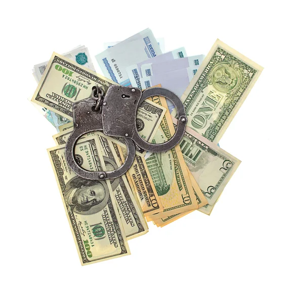 stock image Handcuffs and money isolated on a white background