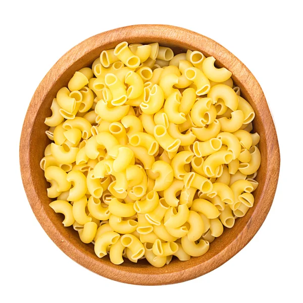 stock image Uncooked pasta in a wooden bowl