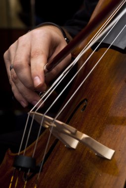 Hands playing cello clipart