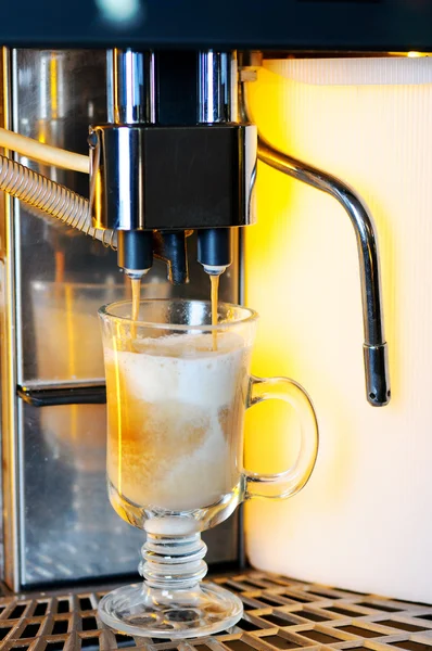 stock image Making cappuccino in coffee machine