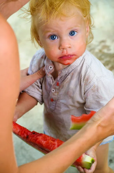 Infant baby with a melon — Stock Photo, Image