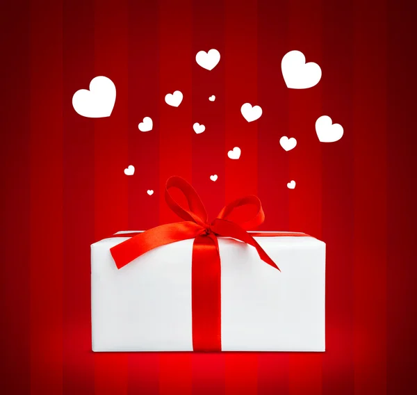 Present box with red ribbon. — Stock Photo, Image