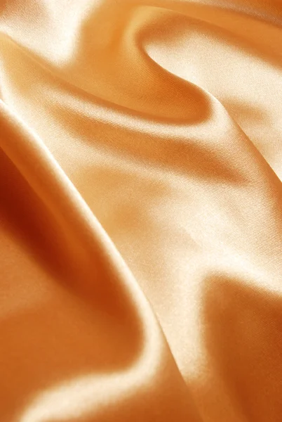 Золотой атласный фон — стоковое фото