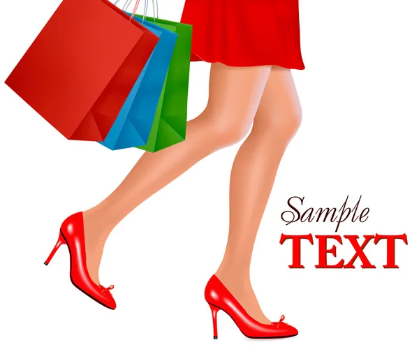 Vista de la cintura hacia abajo de la mujer de compras que usa zapatos rojos de tacón alto y lleva — Archivo Imágenes Vectoriales
