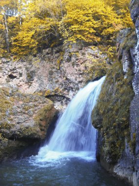 Honey waterfalls and autumn. The North Caucas. clipart