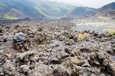 Lava rocks close up on volcano slope of Etna clipart