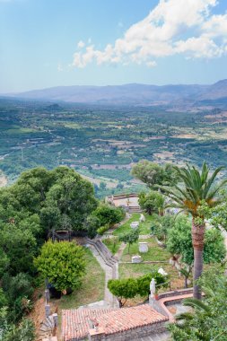 View on old italian yard and mountain valley clipart