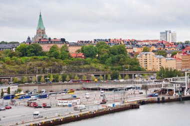 View on shipping terminal and old Sofia Church in Stockholm clipart