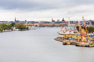 View on Tivoli Grona Lund and Beckholmen island Stockholm clipart
