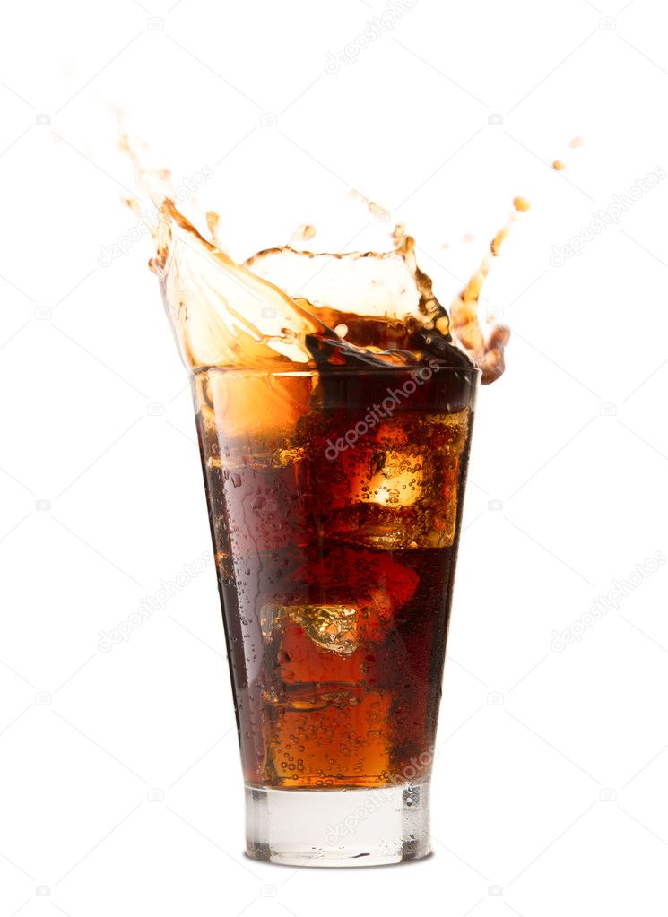 Ice cube droped in cola glass and cola splashing