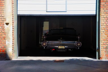 Vintage car in garage clipart