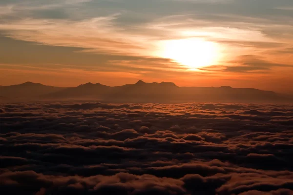 Sunrise above clouds Royalty Free Stock Images